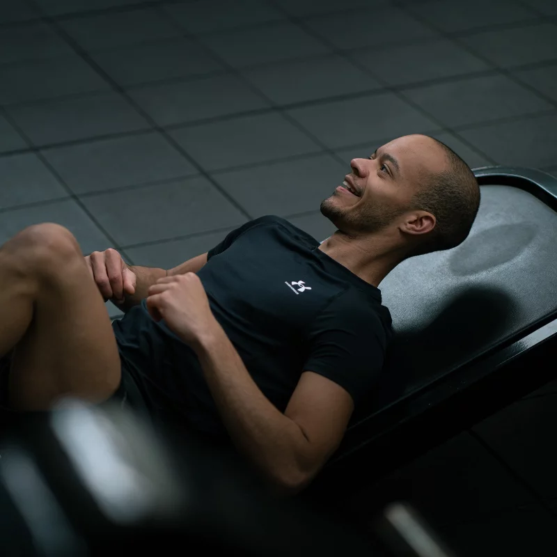 Young man in leg press